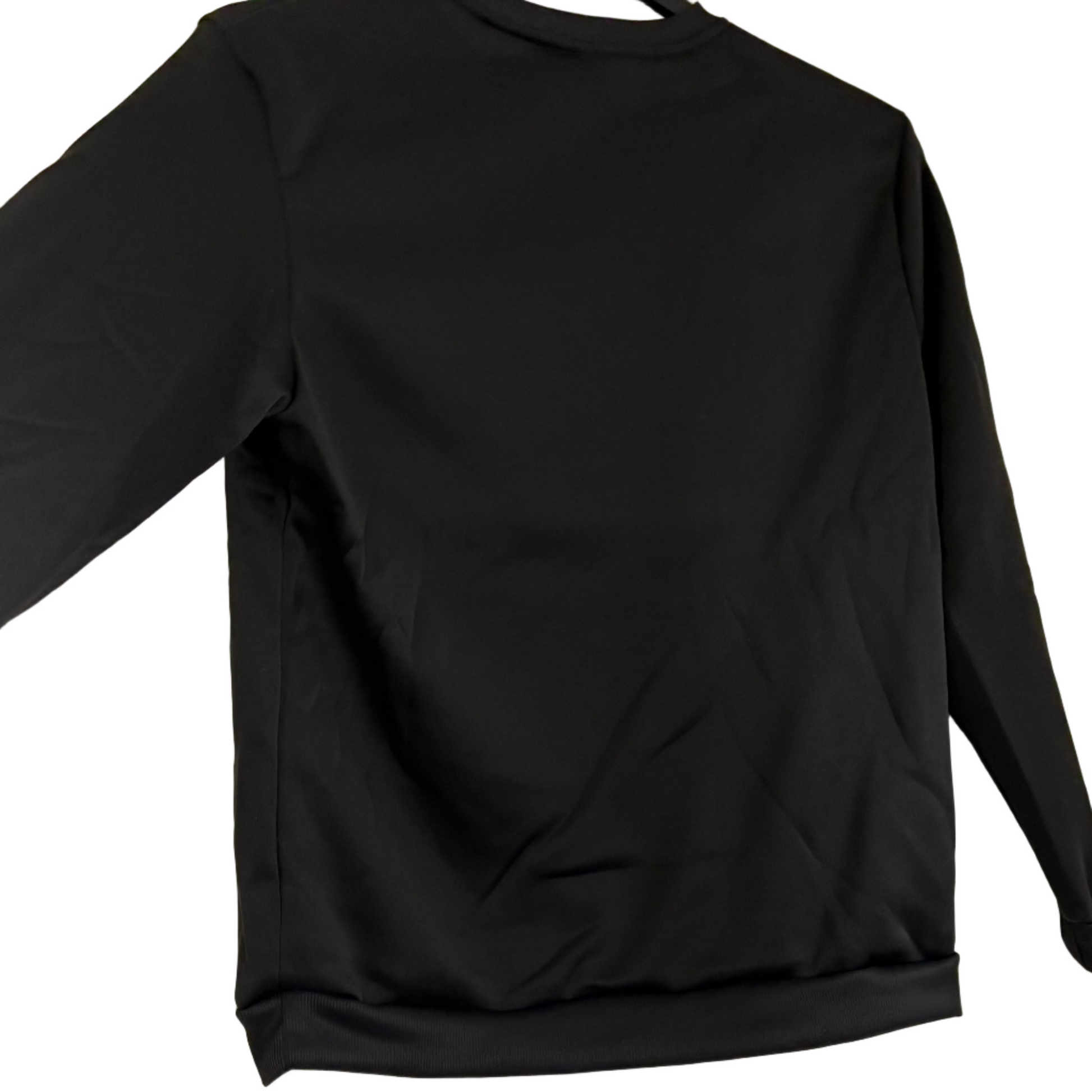 Black long-sleeve shirt hanging on a door