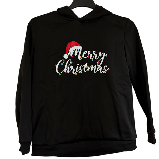 Black hoodie with 'Merry Christmas' text and Santa hat graphic on a hanger against a white door.